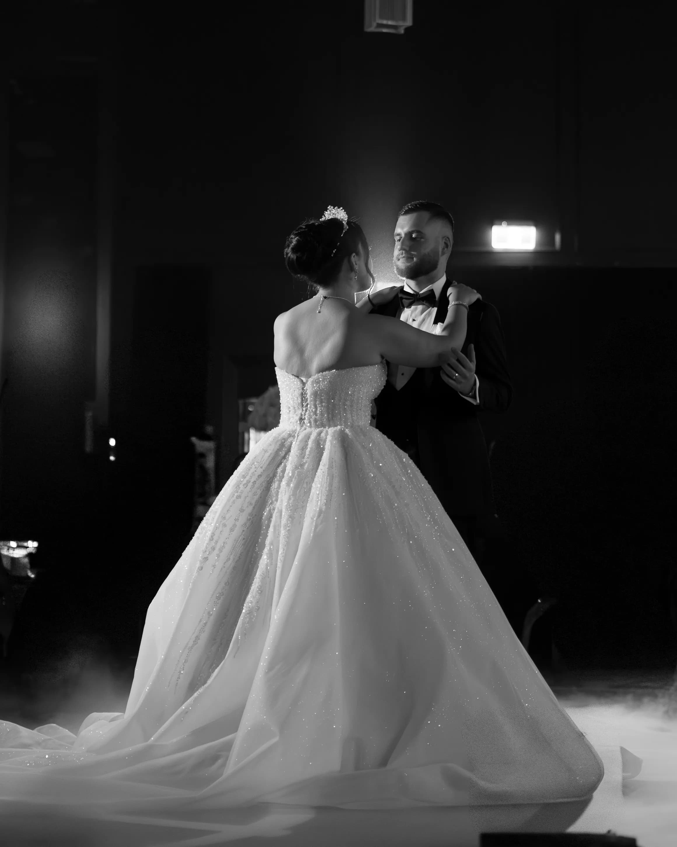 Couple walking hand in hand on grand stairs in a documentary-style Sydney wedding photo