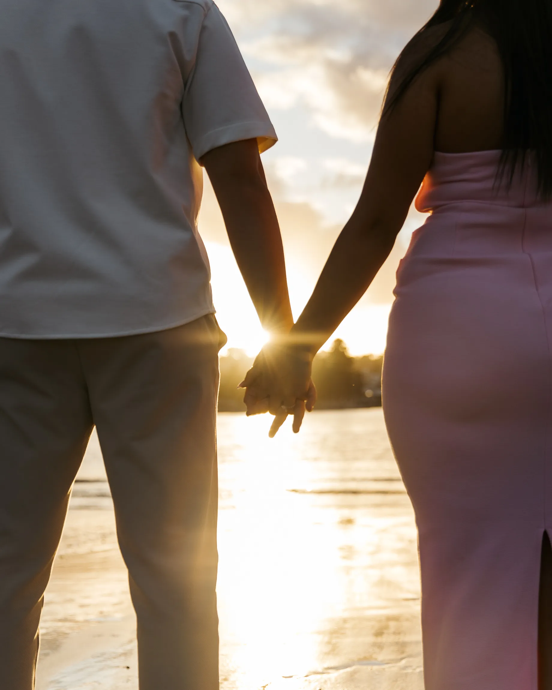 Golden-hour engagement portrait with intimate framing and natural expression in Sydney