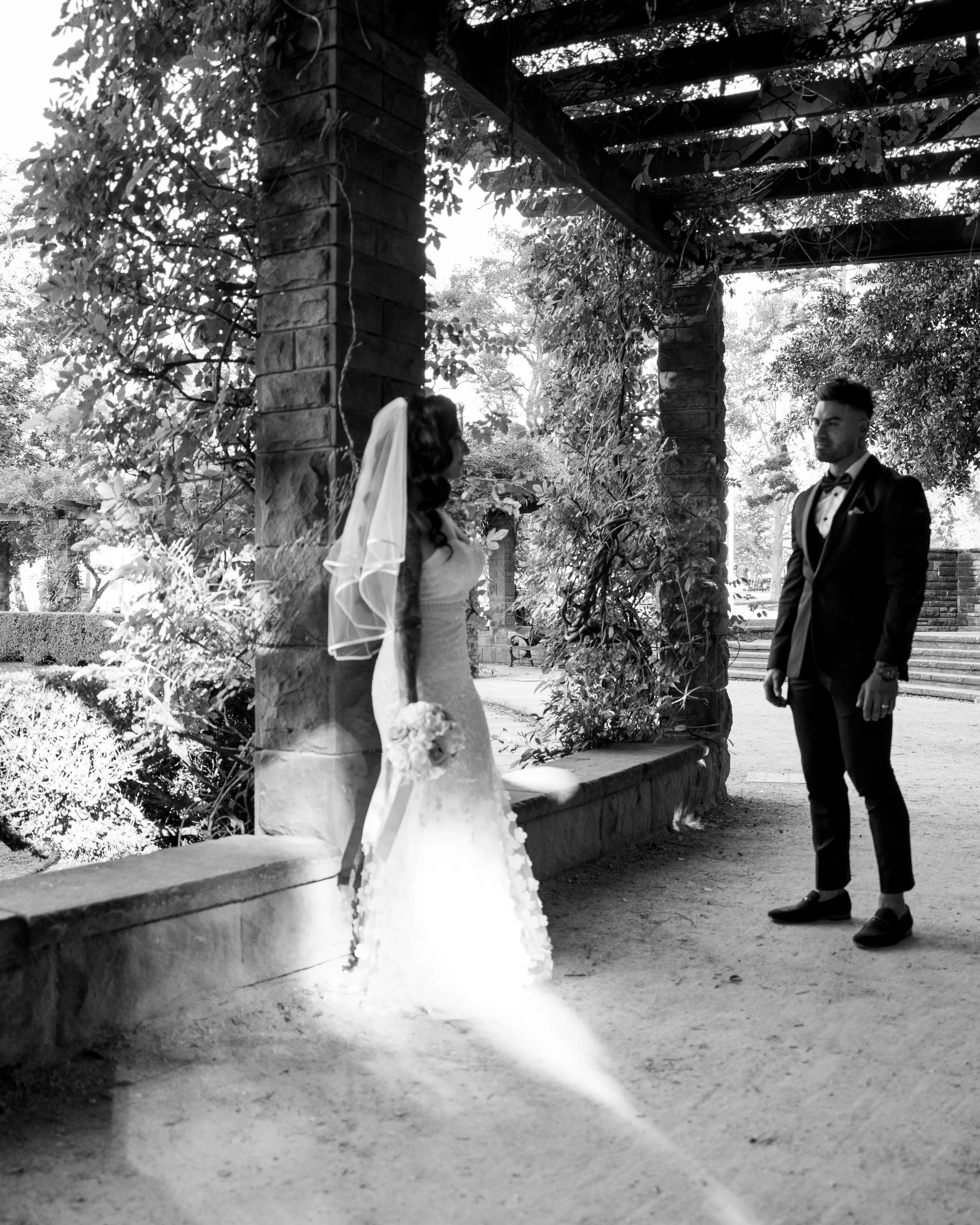 Black and white first dance moment captured with cinematic contrast by Studio HNR in Sydney