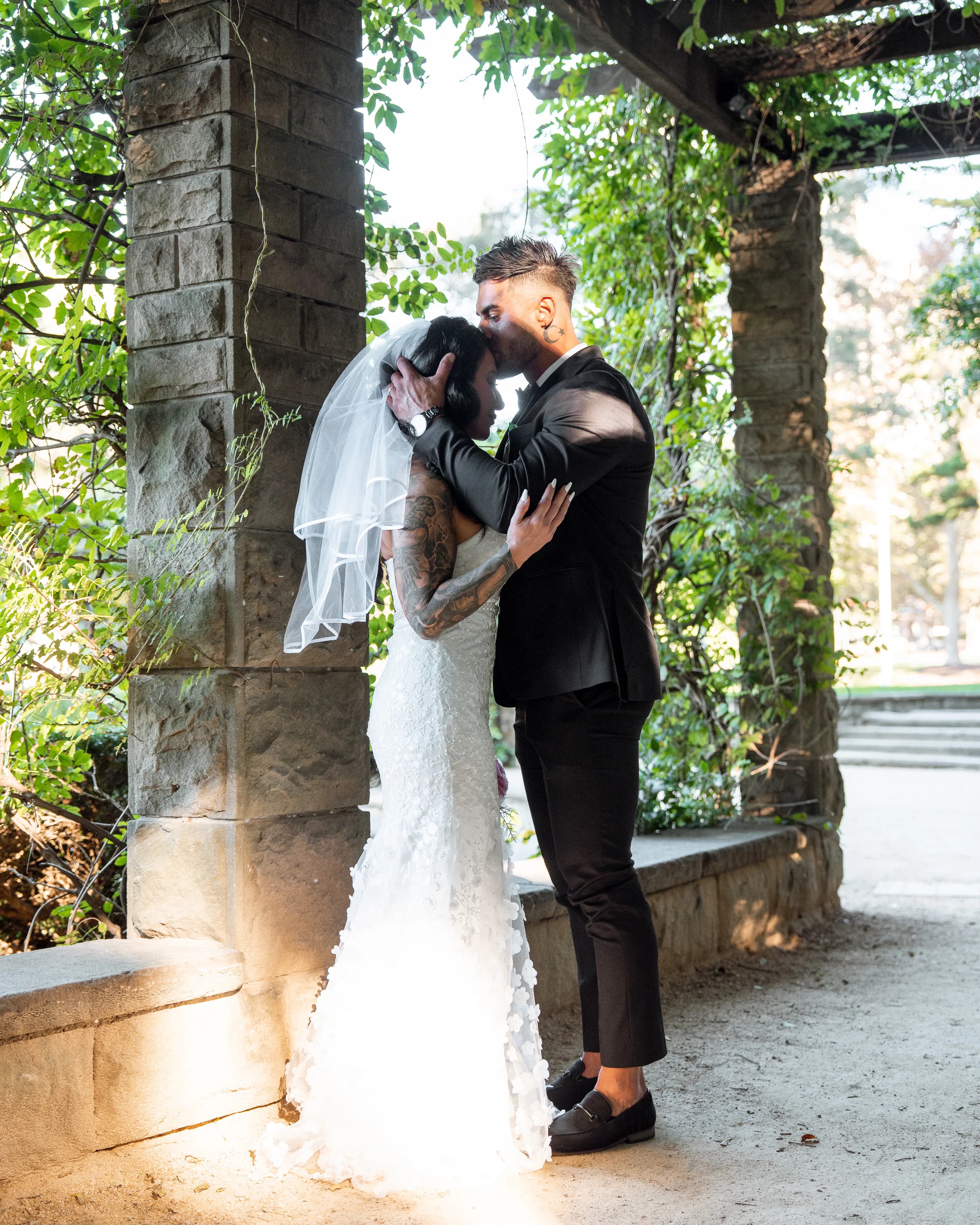 Couple walking hand in hand on grand stairs in a documentary-style Sydney wedding photo